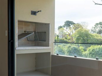 Apartamento de 2 dormitorios a estrenar en Housing cerrado con parrillero