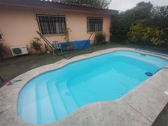 Venta de casa de 4 dormitorios con apartamento independiente, piscina y barbacoa – Lomas de Solymar Sur - foto 7